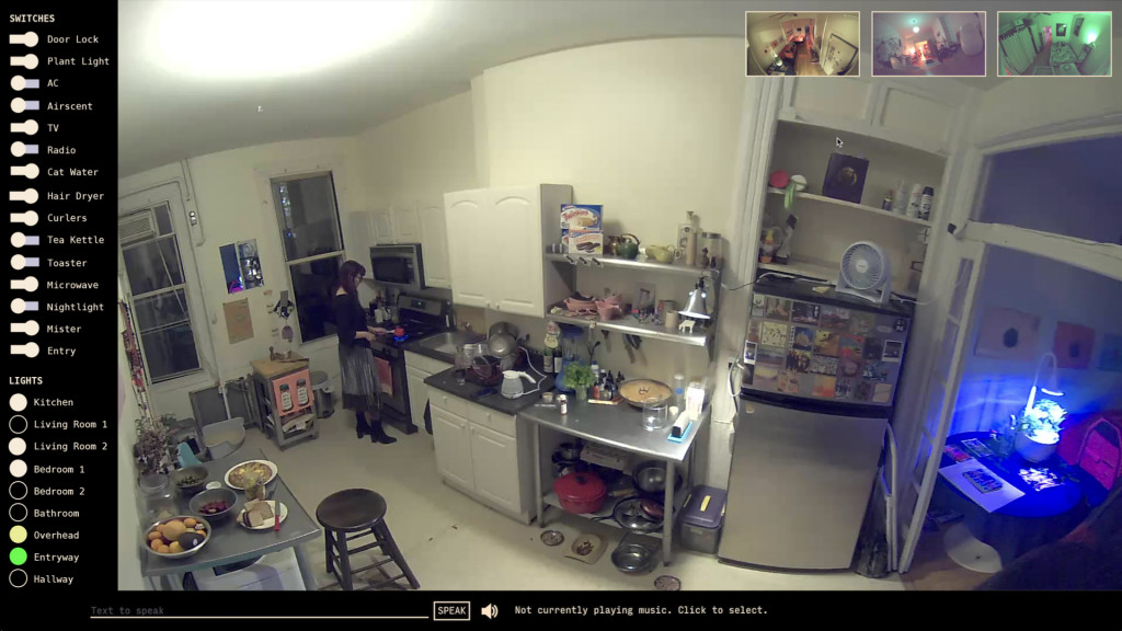 A surveillance camera view of a well-stocked kitchen, with a vertical bar at the left listing controls of the room's enivronment like lighting and appliances