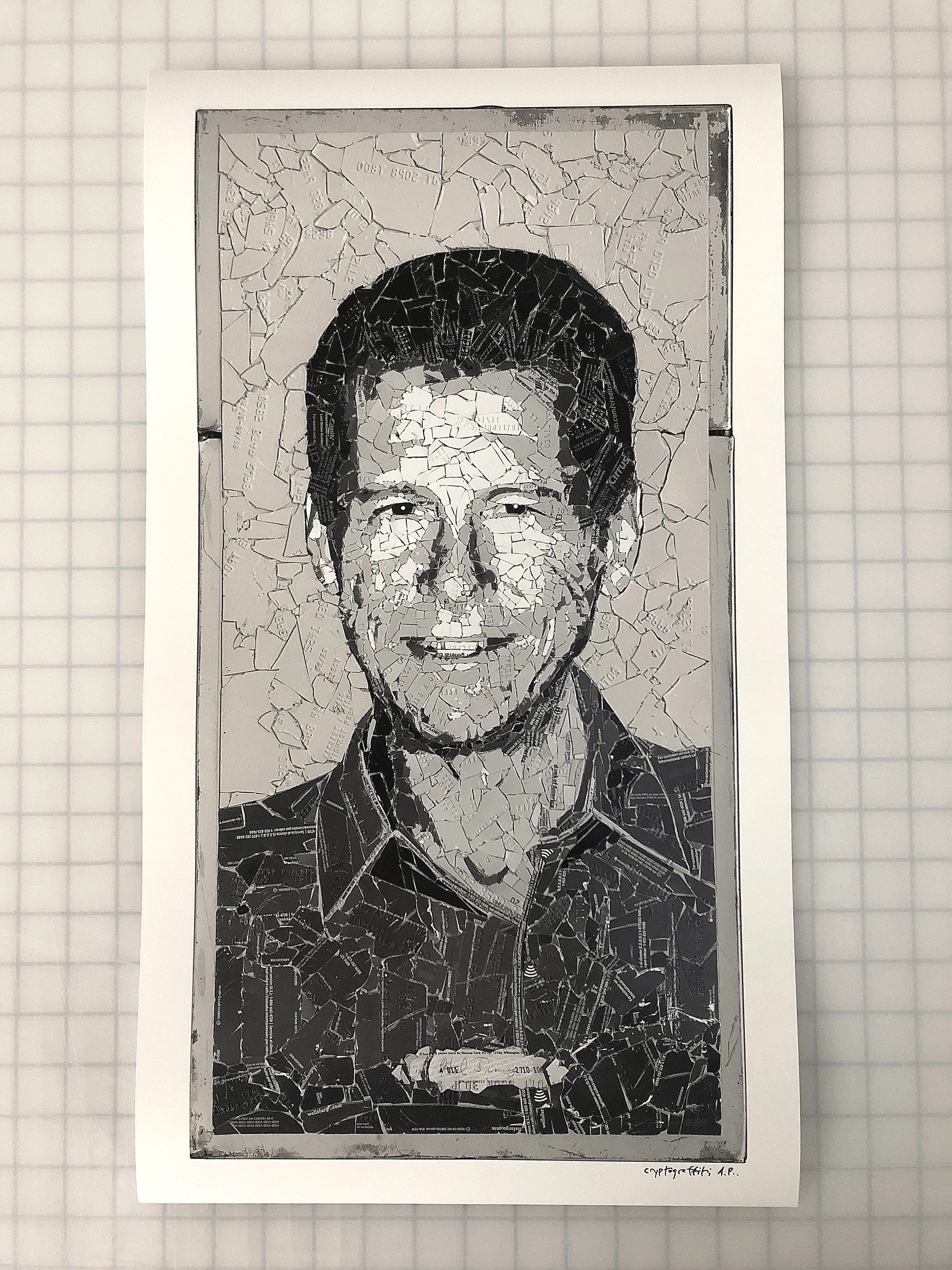 A monochromatic print with a portrait of a middle-aged white man as if seen through cracked glass