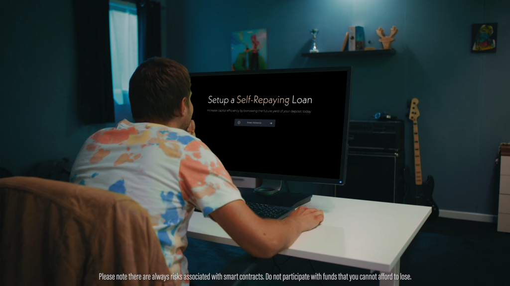 A photograph of a person sitting at a desk, viewing a webpage that says "Setup a Self-Repaying Loan"