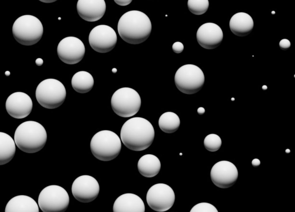 A digital image of many white spheres floating in black space