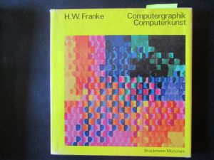 A picture of a book with a multicolored geometric design on its cover, bordered with bright yellow