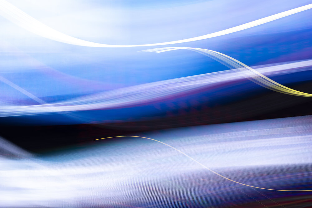 An abstract composition of fluid white, indigo, violet, and blue lines