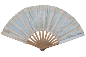 A photograph of a fan with wooden slats and blue and pink fabric spalyed open