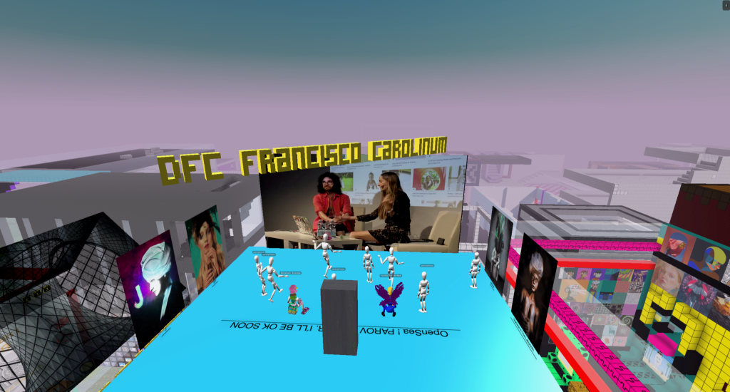 An image of a place in a virtual world, with avatars gathered on a blue plaza to look at artworks under a pink sky