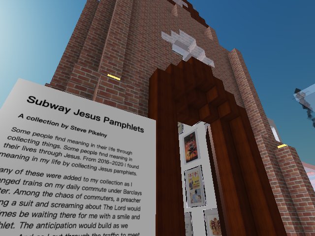 A screenshot of a virtual environment, showing the exterior of a tall brick church with a sign outside explaining what lies within
